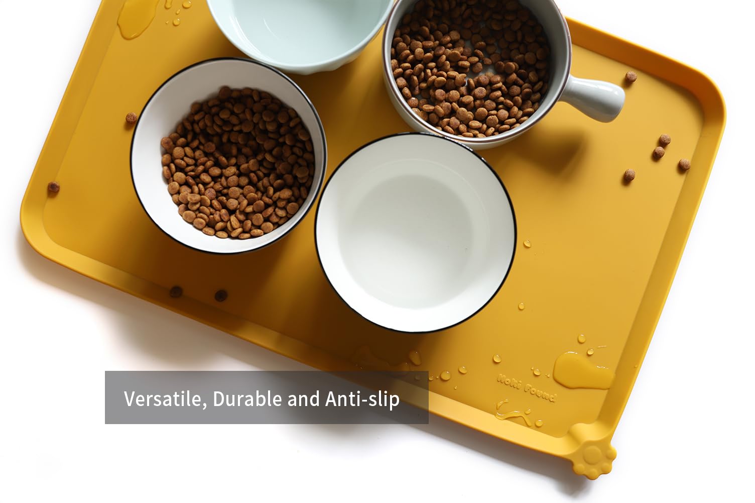Hoki Found L travel-ready mat demonstrates portable, durable dining for pets away from home.