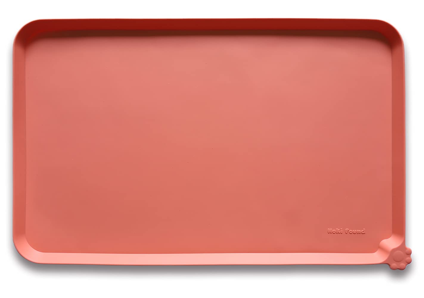 Hoki Found L silicone non-slip pet feeding tray in burnt coral, angled to show raised edge.