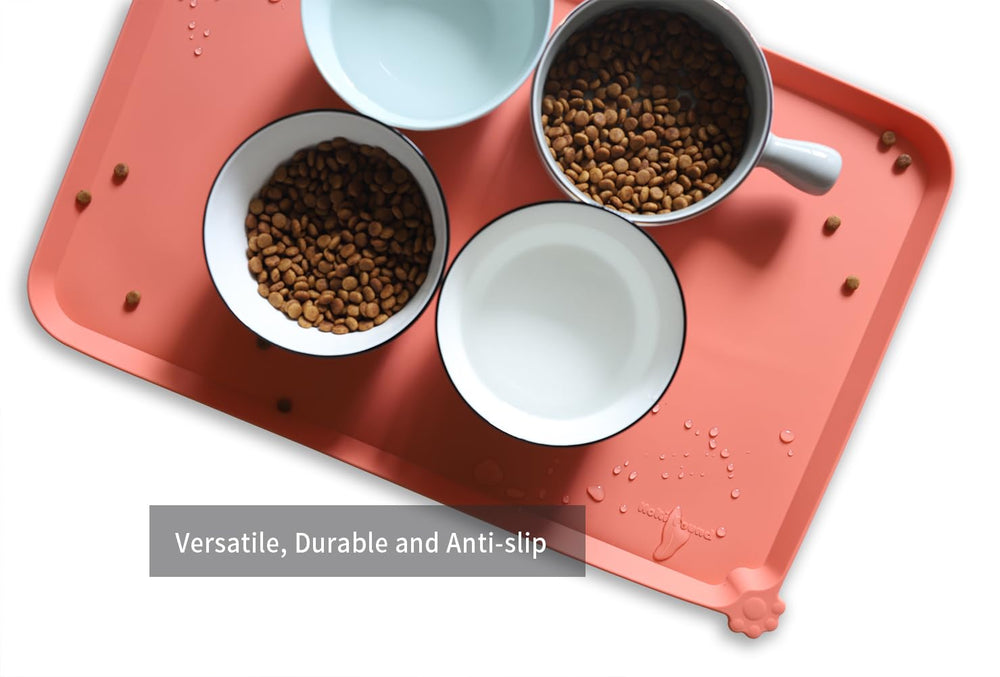 Hoki Found L silicone non-slip tray with extra-high lip to prevent spills.
