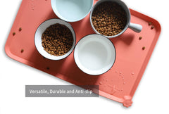 Hoki Found L silicone non-slip tray with extra-high lip to prevent spills.
