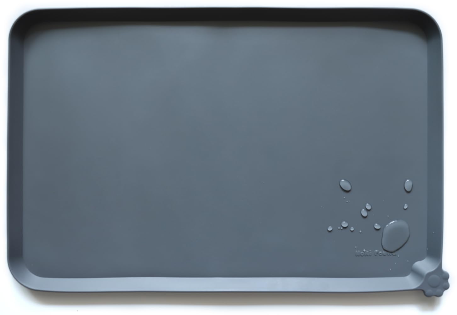 Hoki Found L silicone pet food mat in gray keeps floors clean during meals.