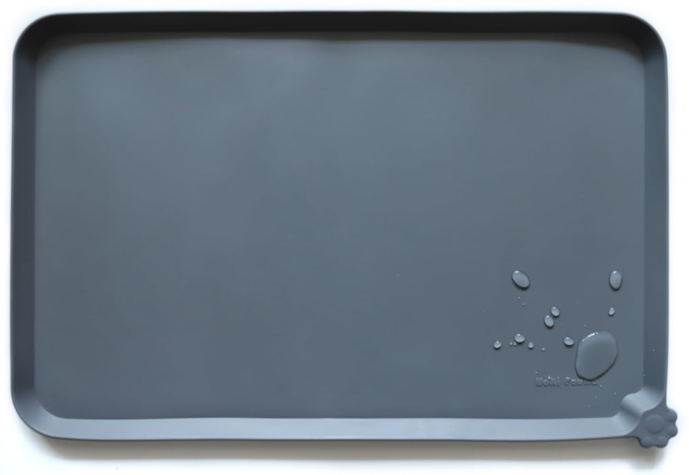 Hoki Found L silicone pet food mat in gray keeps floors clean during meals.