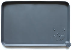 Hoki Found L silicone pet food mat in gray keeps floors clean during meals.