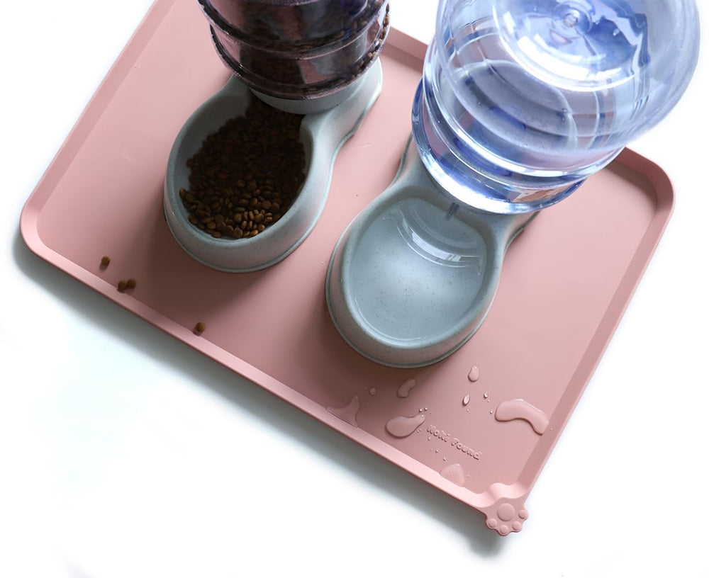 Hoki Found neutral pink feeding mat rolled for travel, portable and durable.