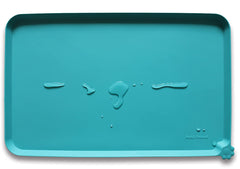 Hoki Found silicone non-slip pet feeding mat teal closeup shows easy-clean, spill-preventing surface.