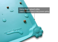 Hoki Found teal feeding mat on floor demonstrates waterproof, floor-protecting design.