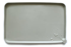 Hoki Found X-Large silicone pet feeding mat in cream green lays flat, easy to clean.