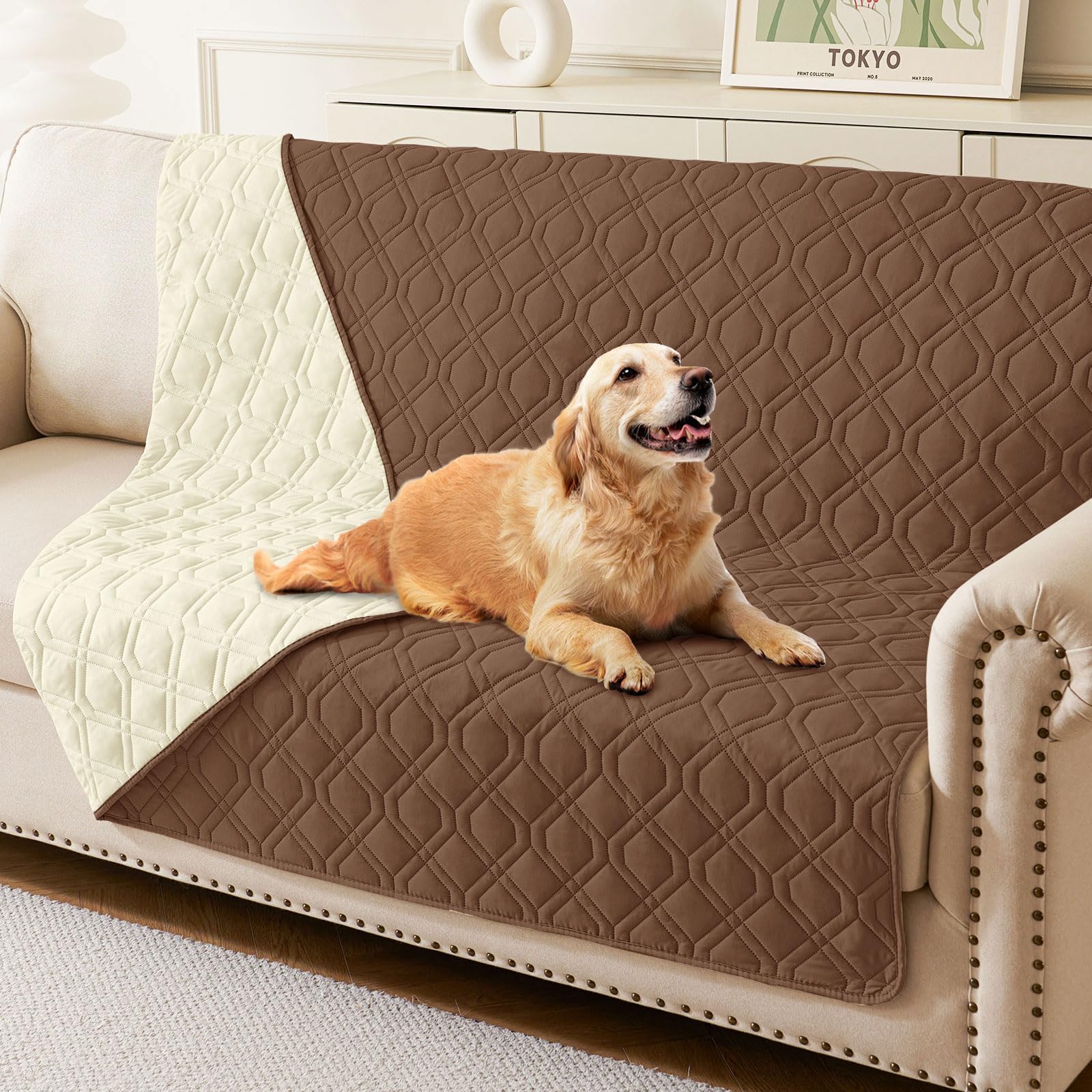 hyha waterproof dog bed blanket folded on a couch demonstrates triple waterproof protection for furniture