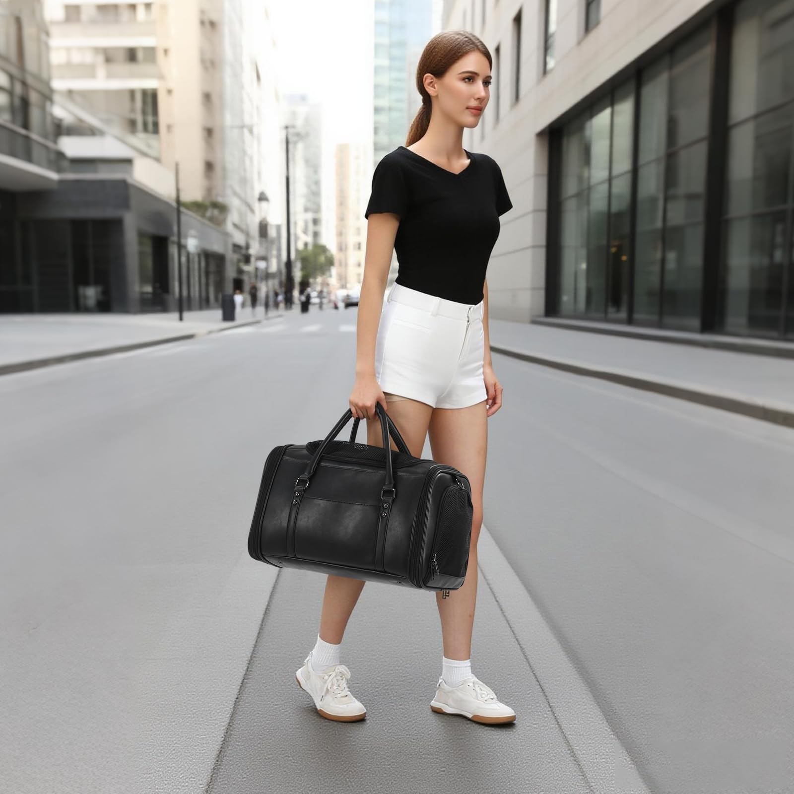 Johomviin black pet carrier close-up shows a sleek, modern finish.