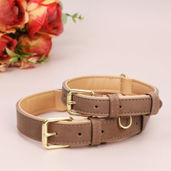 Jumpress leather dog collar light brown D-ring close-up reveals multi-use tag ring and sturdiness.