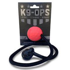 K9 Ops Moki ball in ruby red with rope for durable fetch training