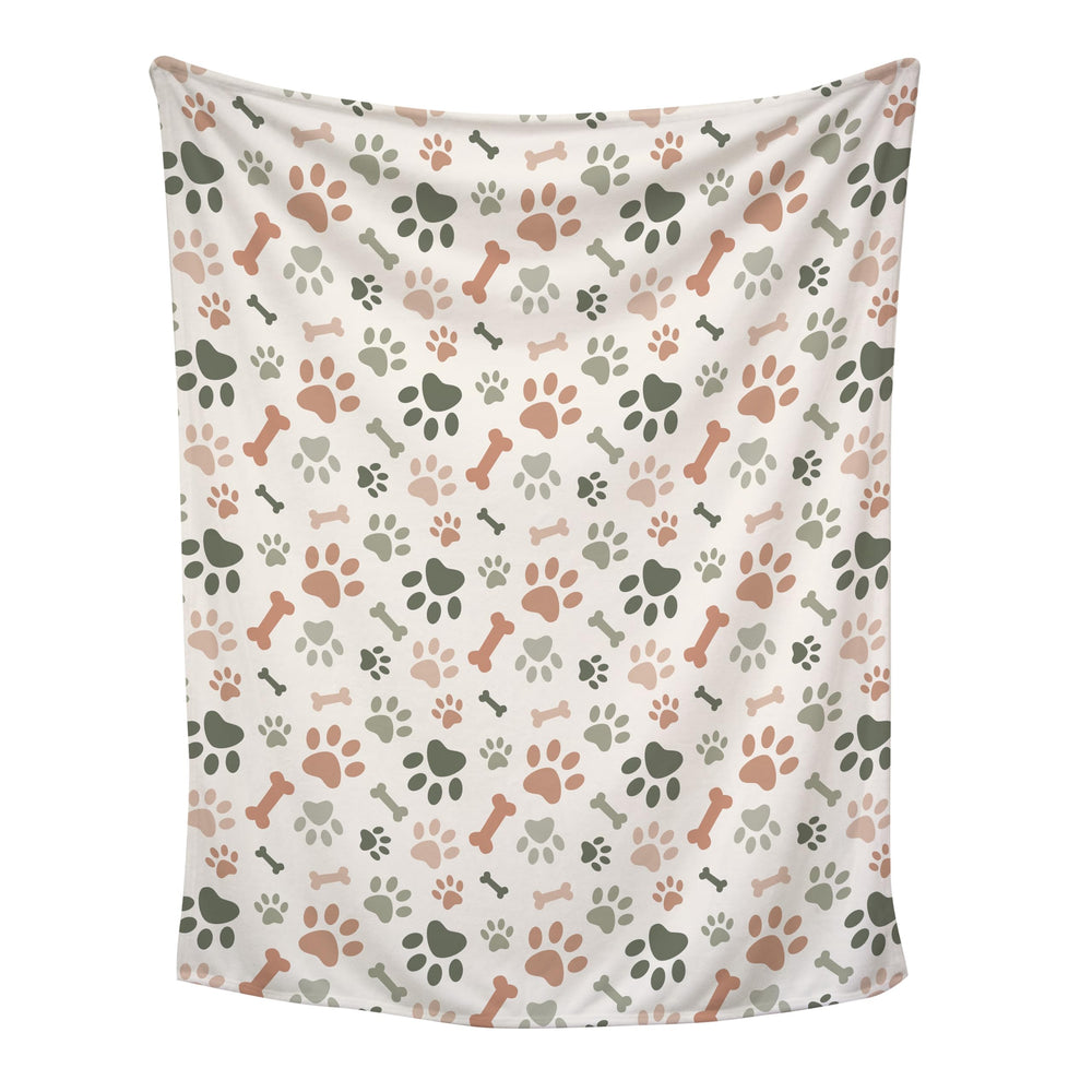 Karisma Decor cream paw print blanket close-up of soft fleece for cozy snuggles.