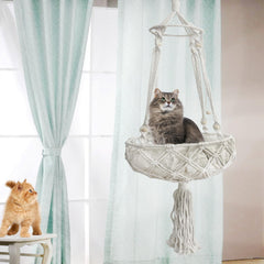Kathson cat hammock installed in room highlights space-saving boho decor.