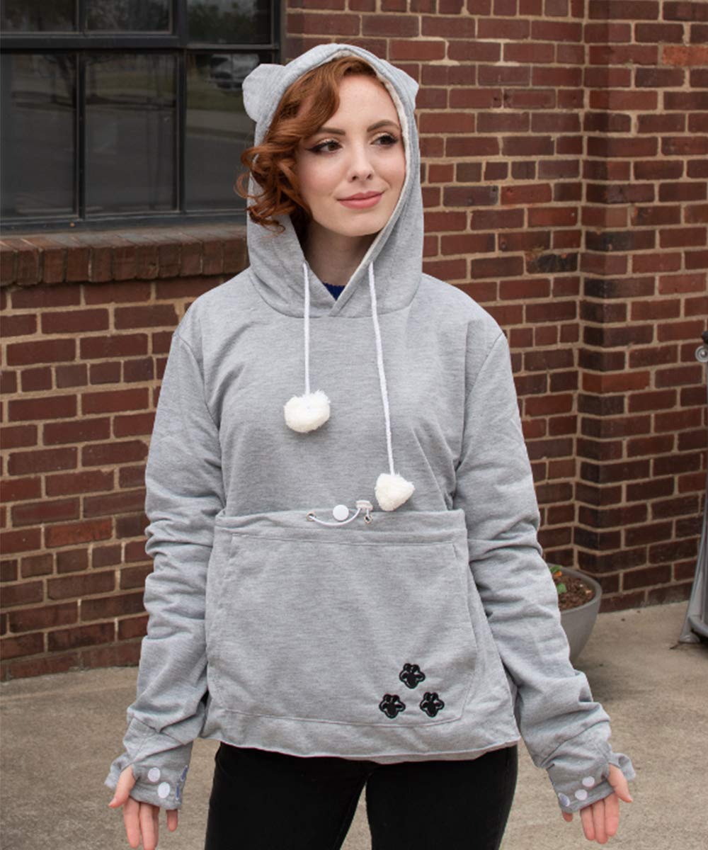 Kei Tomlison pet-snuggle in pocket demonstrates hands-free comfort during walks.
