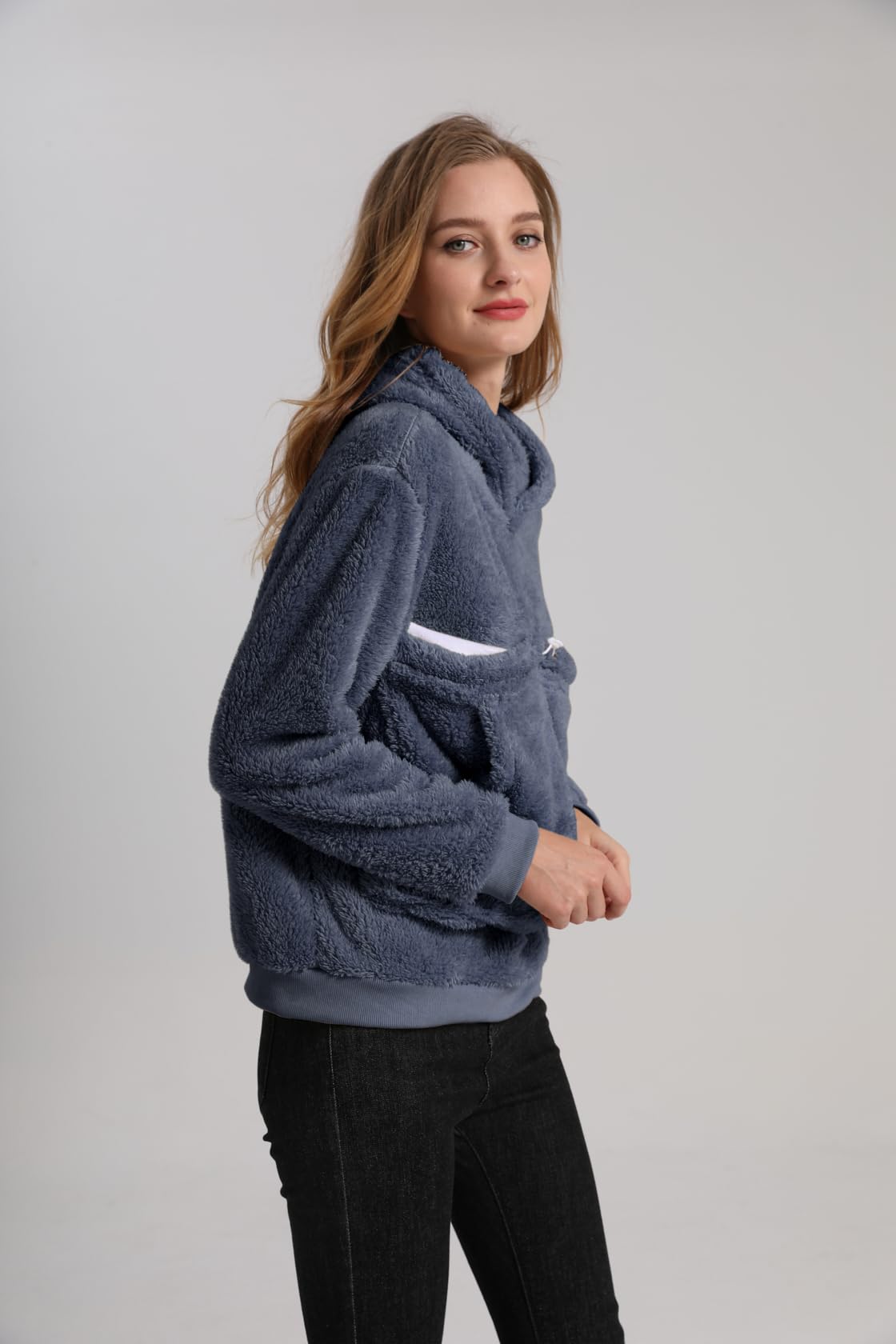 Kei Tomlison hoodie used at a desk for cozy pet companionship.