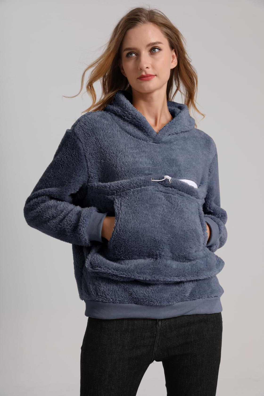 Kei Tomlison hoodie side view showing warm fleece-lined pouch.