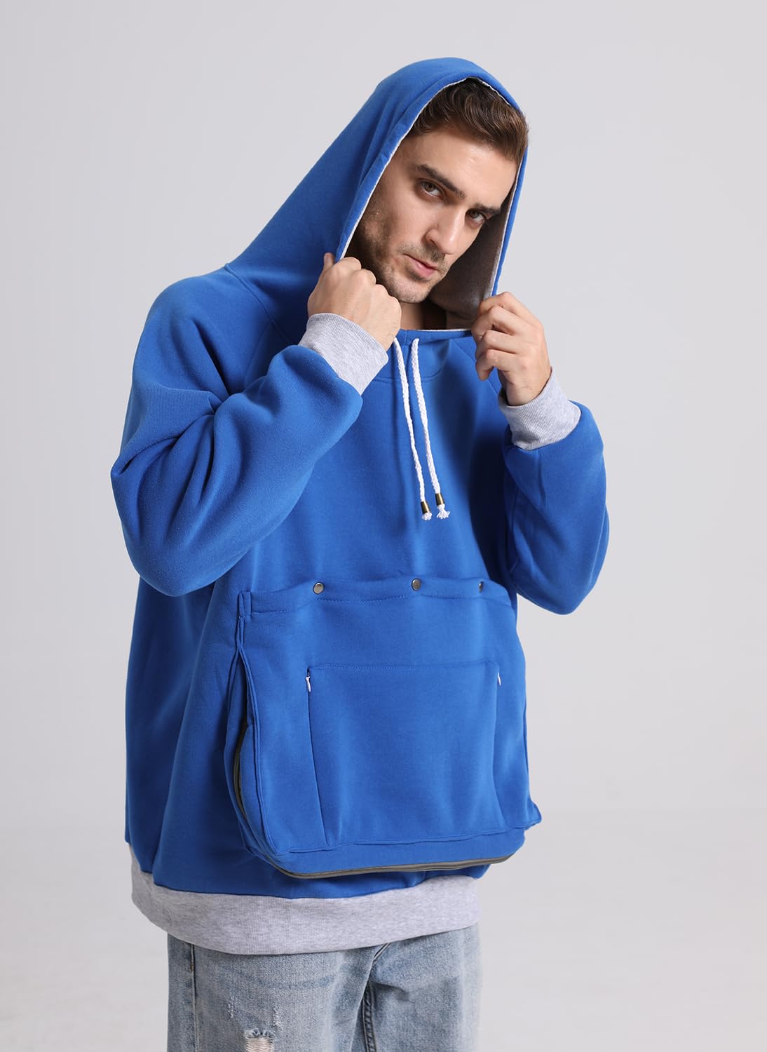 Kei Tomlison pouch hoodie shows large front pocket for phone or snacks
