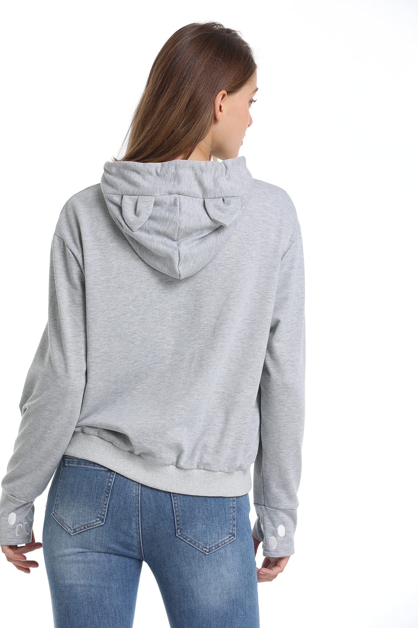 model wearing kei tomlison hoodie demonstrates hands-free pet carrying.