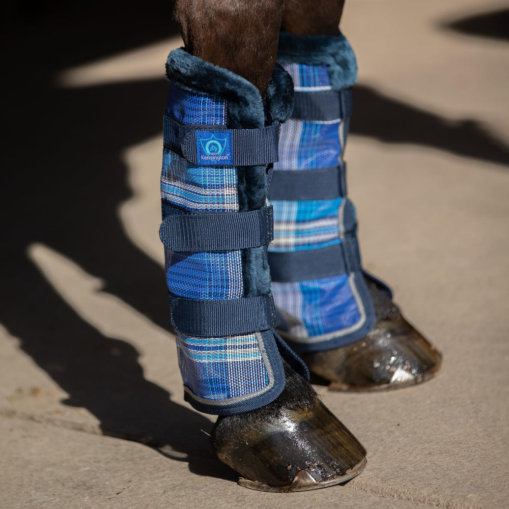 Kensington Horse Fly Boots plaid pattern on leg with adjustable straps.