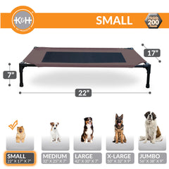 K&amp;H Pet Products sturdy metal frame supports a small dog cot in a backyard setup.