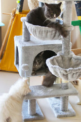 KIYUMI cat tree hammock illustrates double cozy spaces ideal for cat lounging.