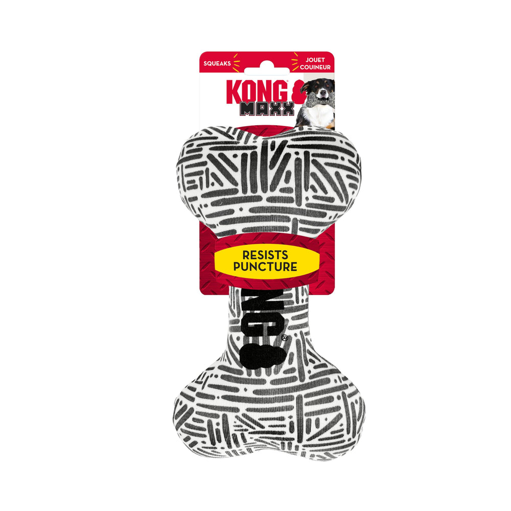 KONG Maxx Bone Sm/Md being chewed to highlight durable stitching and extended play.