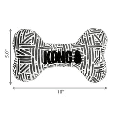 KONG Maxx Bone Sm/Md indoor-outdoor play mood shot emphasizing versatile use.