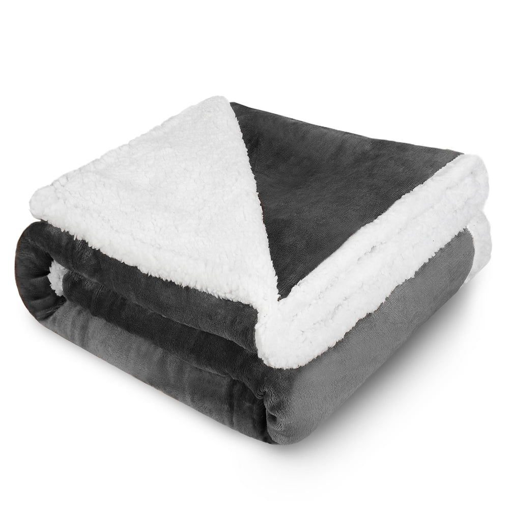 Kritter Planet dog blanket grey folded on sofa for cozy couch comfort