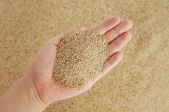 LANDEN Namale sand being layered in tank for natural riverbed look.