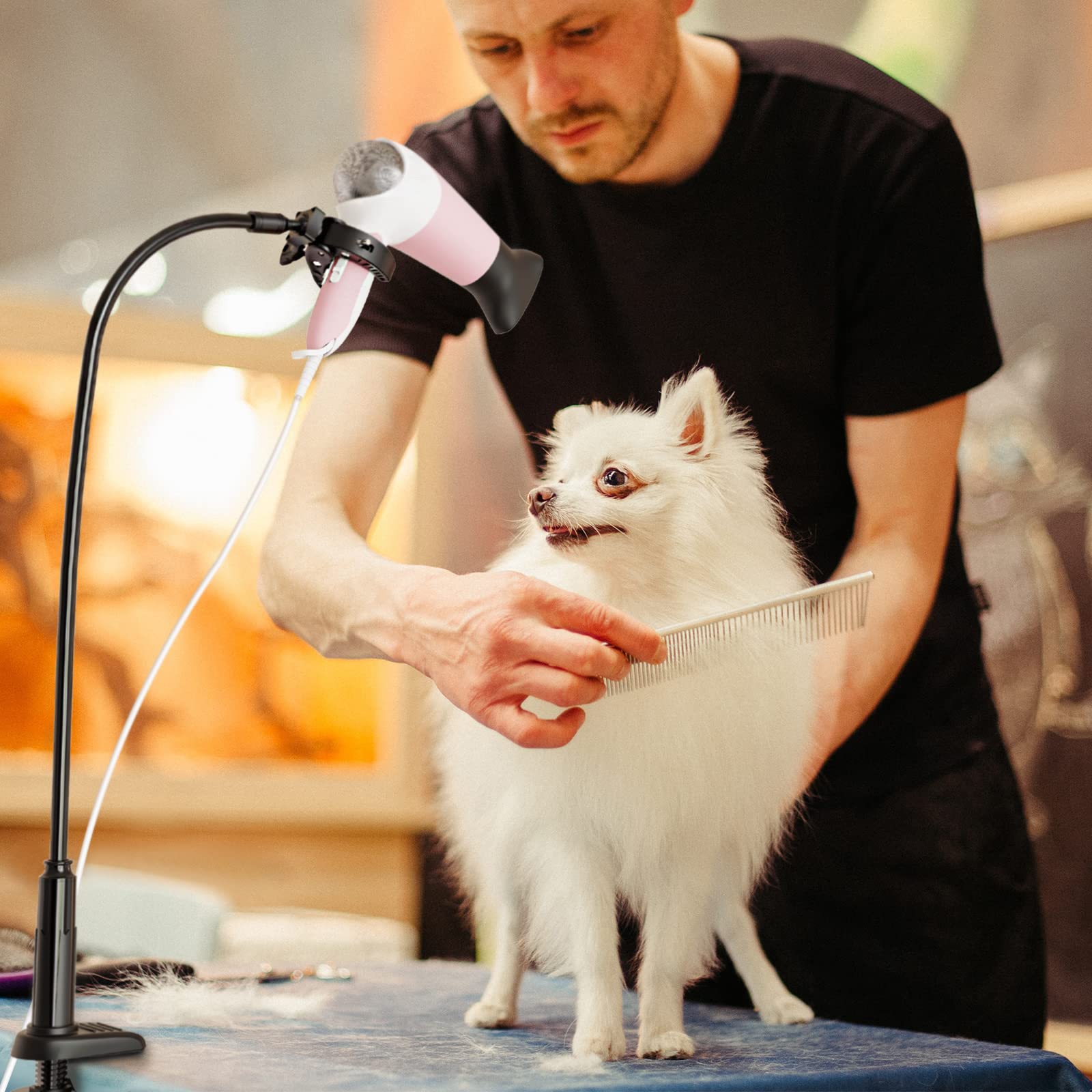 Linkidea stand in-use on a grooming table shows hands-free operation.
