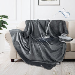 LOOBANI waterproof dog blanket on couch in grey, protects furniture from spills.