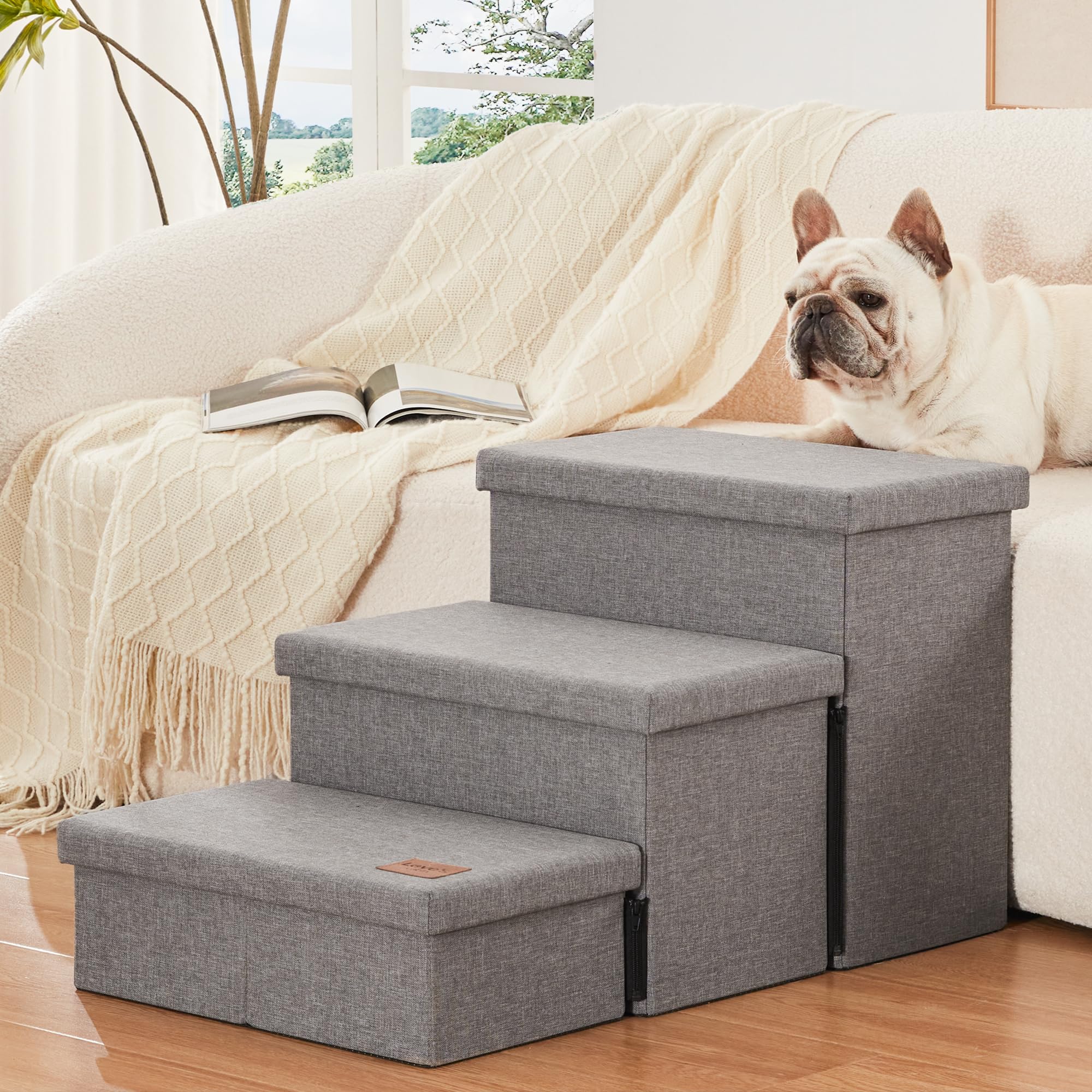 Love's cabin dog stairs in-use beside bed for gentle pet access.