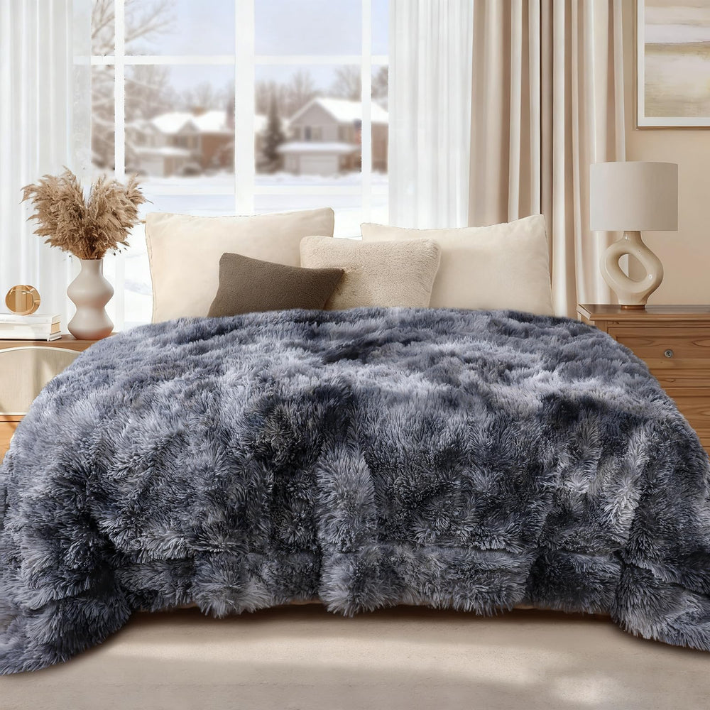 Luciphia tie-dye grey dog blanket on sofa provides cozy comfort and couch protection.