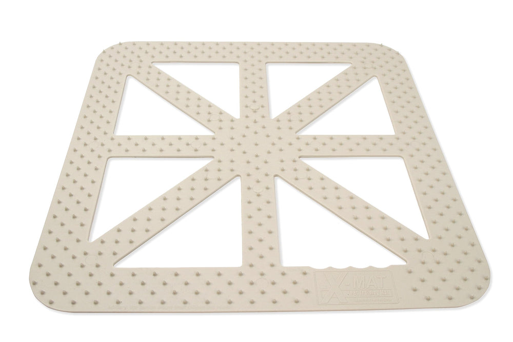 Mammoth X-Mat training mat on sofa deters pets from furniture.