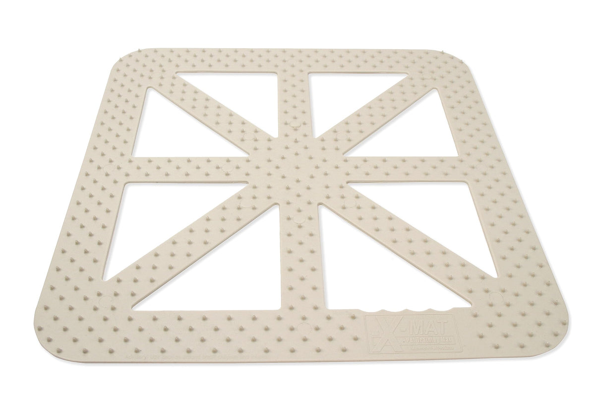 Mammoth X-Mat training mat on sofa deters pets from furniture.
