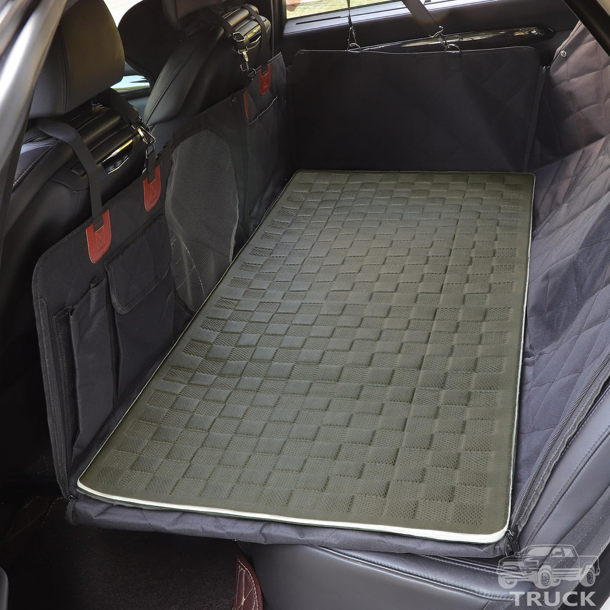 Manificent non-slip pet bed mat on back seat extender for safer, steadier rides.