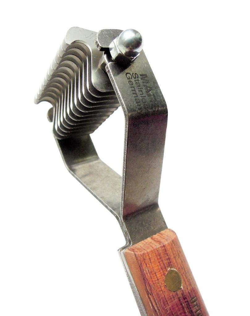 Mars Coat King dematting tool used on thick coats for dogs and cats