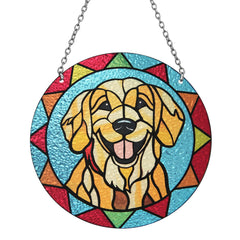 Marwey dog memorial suncatcher hanging in a window with warm rainbow light