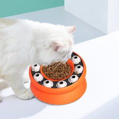MaxcGear orange puzzle feeder close-up shows ergonomic tilt and secure base aiding comfortable dining.