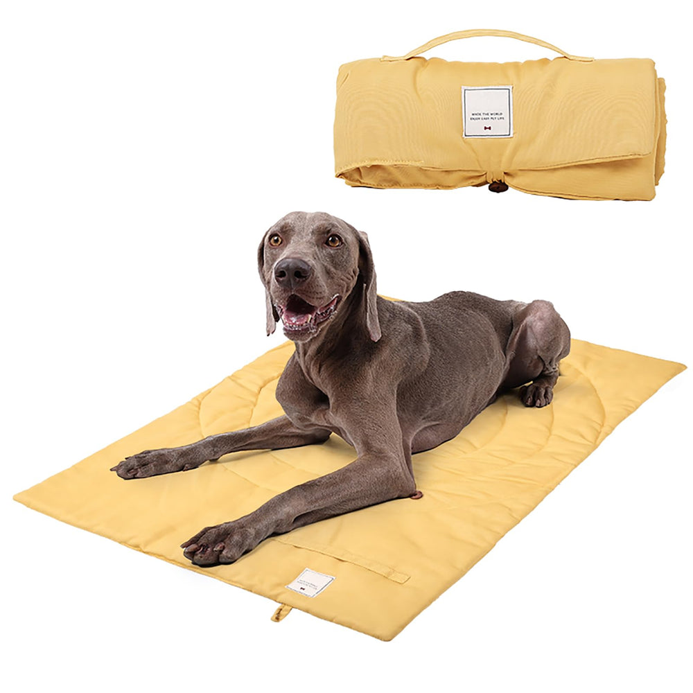 MikooMikoo dog travel mat yellow folded with handle for easy transport.