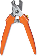 Millers Forge professional large nail clipper 767C in use for smooth, confident paw grooming.