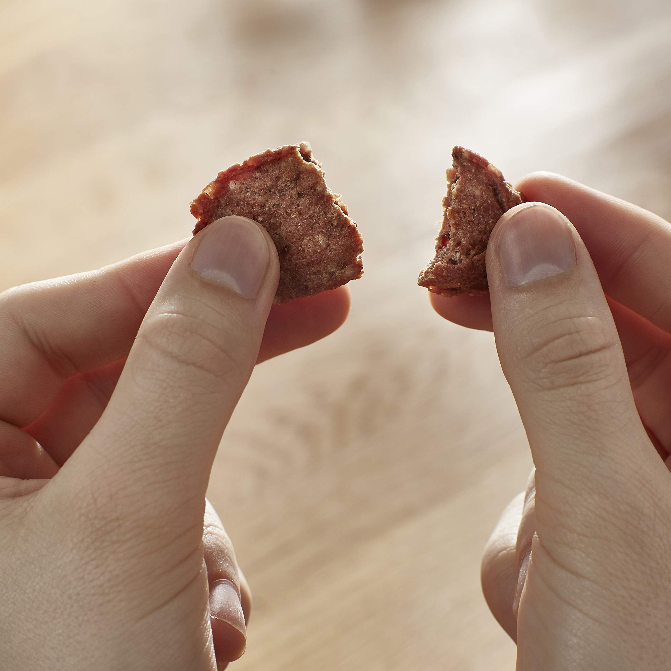 Milo's Kitchen beef sausage slices aroma close-up highlights savory scent.