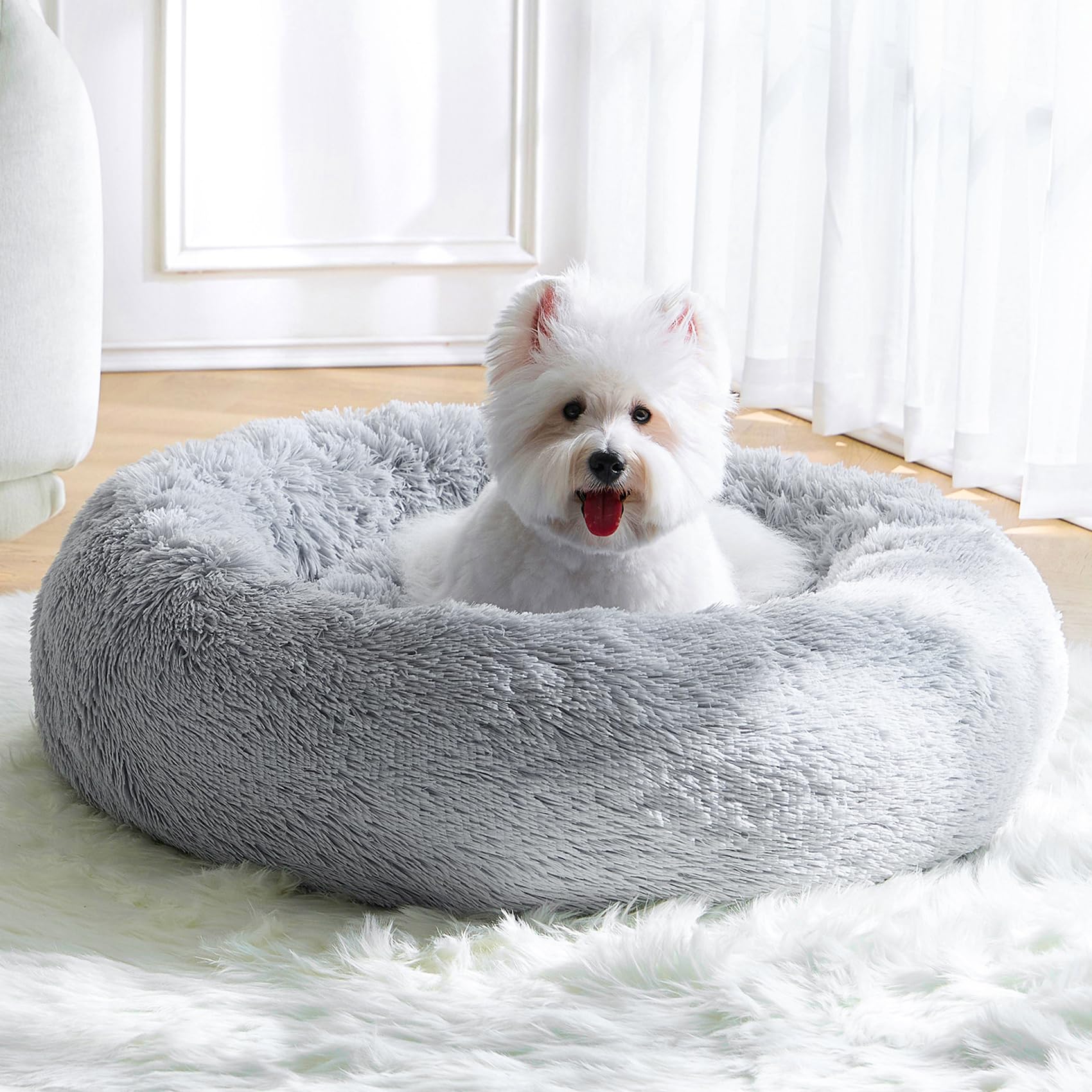 MNWHUC calming small dog bed with donut design for cozy naps and security.