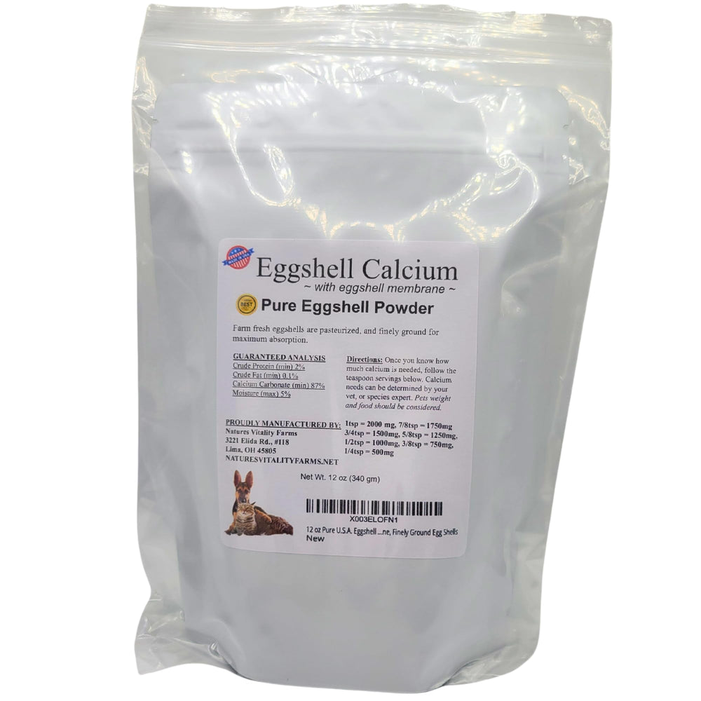 Cat enjoying kibble boosted with Natures Vitality Farms eggshell powder for nutrition.