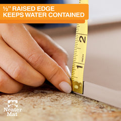 Neater Mat half-inch raised-edge close-up demonstrates spill containment during meals.