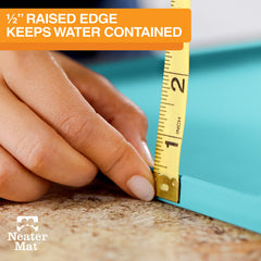 Neater Mat with raised edge keeps spills contained around bowls.