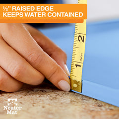 Neater Mat raised edge keeps water contained during feeding.
