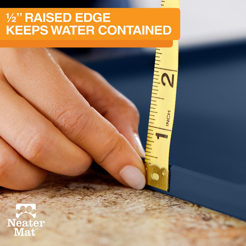 Neater Mat by Neater Pet Brands raised edge contains splashes around bowls.