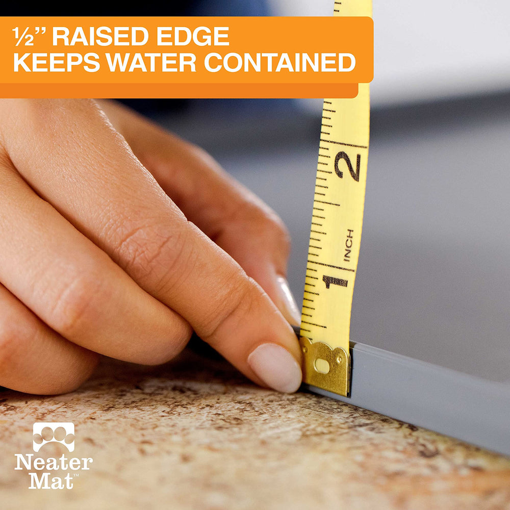 Neater Mat raised edge helps catch splashes around bowls.