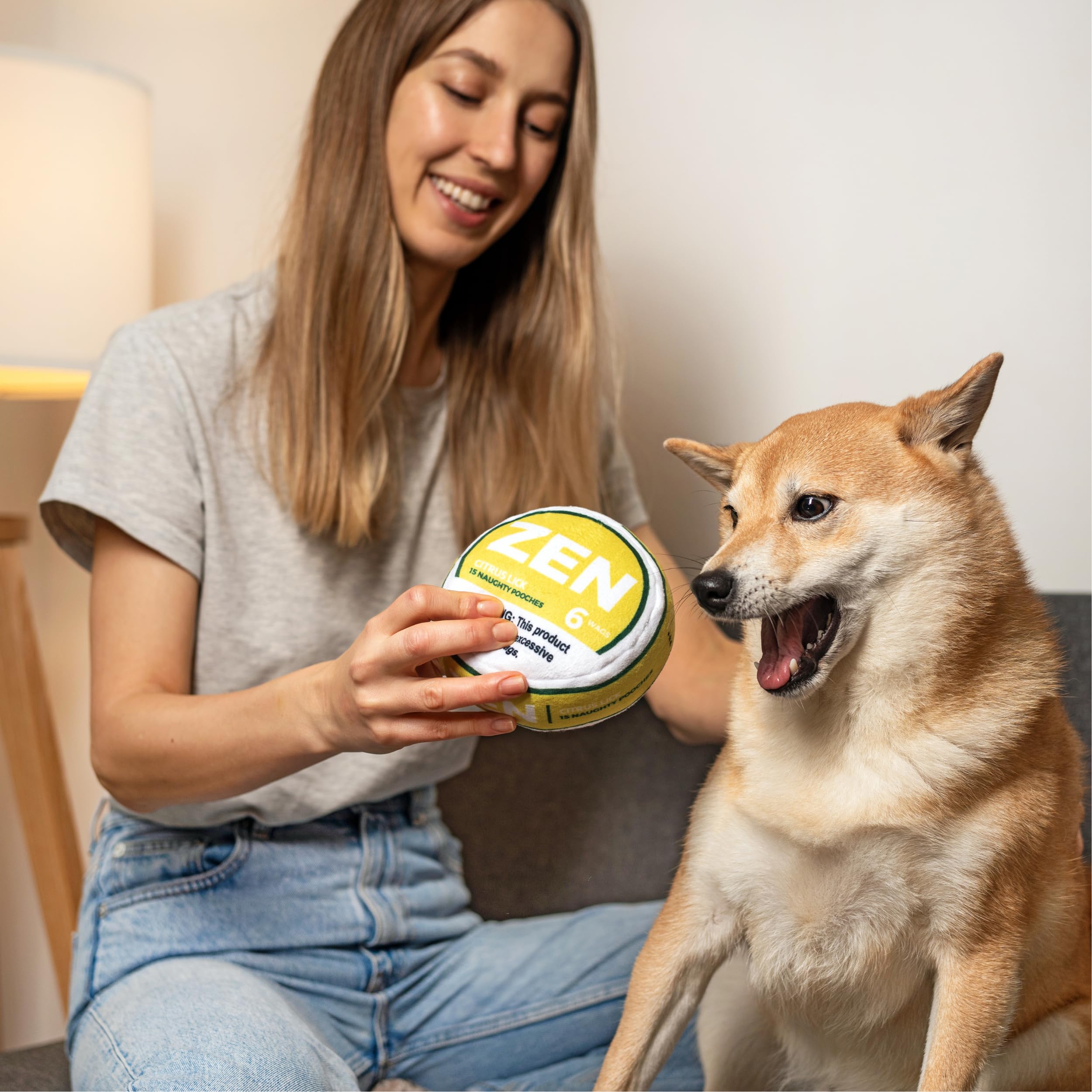 Nestpark Zen Pupper Deckies squeaky action captures dog engagement during fetch.